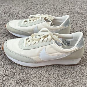 Cream and white Nike shoes